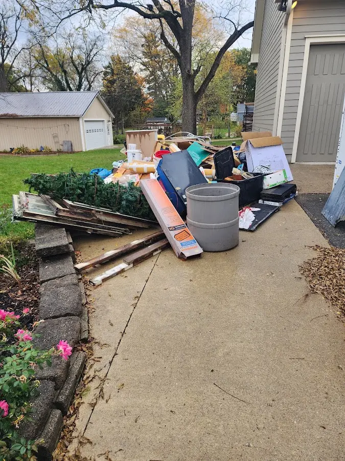 Dumpster being loaded with debris for Commercial Dumpster Rental in Kettering